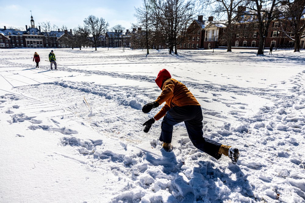 Player tossing a snowsnake across an open field